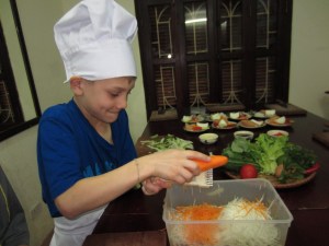 Braxton grates green papaya and carrots