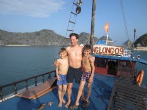 Three boys on a boat, Ha Long Bay
