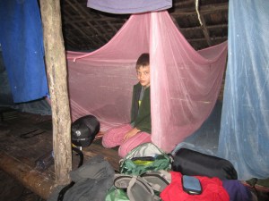 Henry on jungle camp group sleeping platform