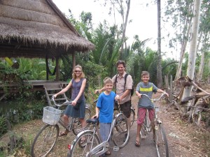 Riding bikes to town, Kampot