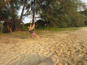 Coco swinging at Lazy Beach, Koh Rong Saloem, Cambodia