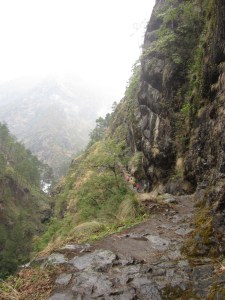 Climbing into the Lower Tsum Valley on a rainy day with the Siyar Khola far below