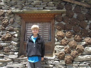 Braxton and a wall full of yak dung fuel, Burji