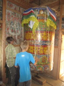 Huge dharma wheel next to Milarepa's cave, Burji