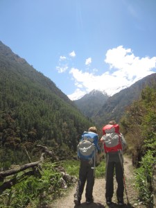 Boys hiking out on a sunny day, entering Lower Tsum Valley