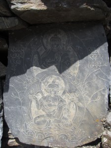 Buddha images begin to appear on the mani walls, Manaslu Circuit